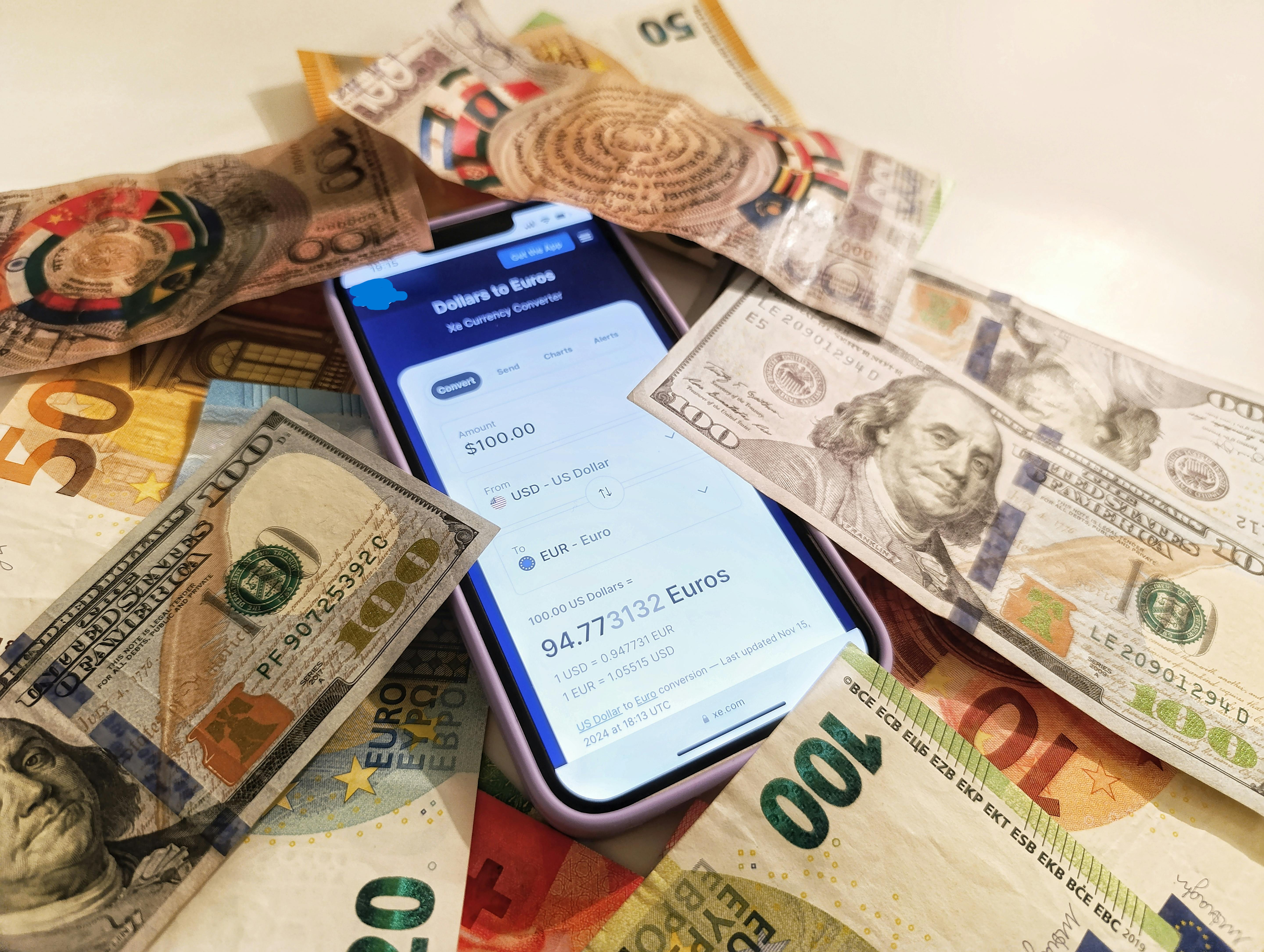 Currency converter comparison on smartphone